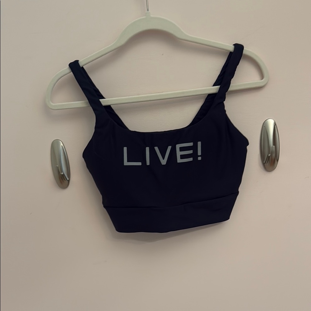 Black sport bra with gray 'LIVE!' Print